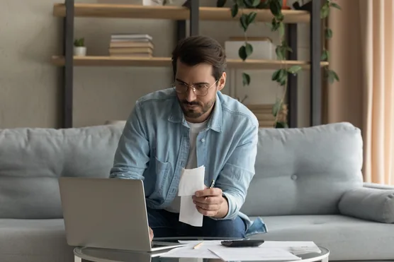 A person reviewing campaign spend at a desk.